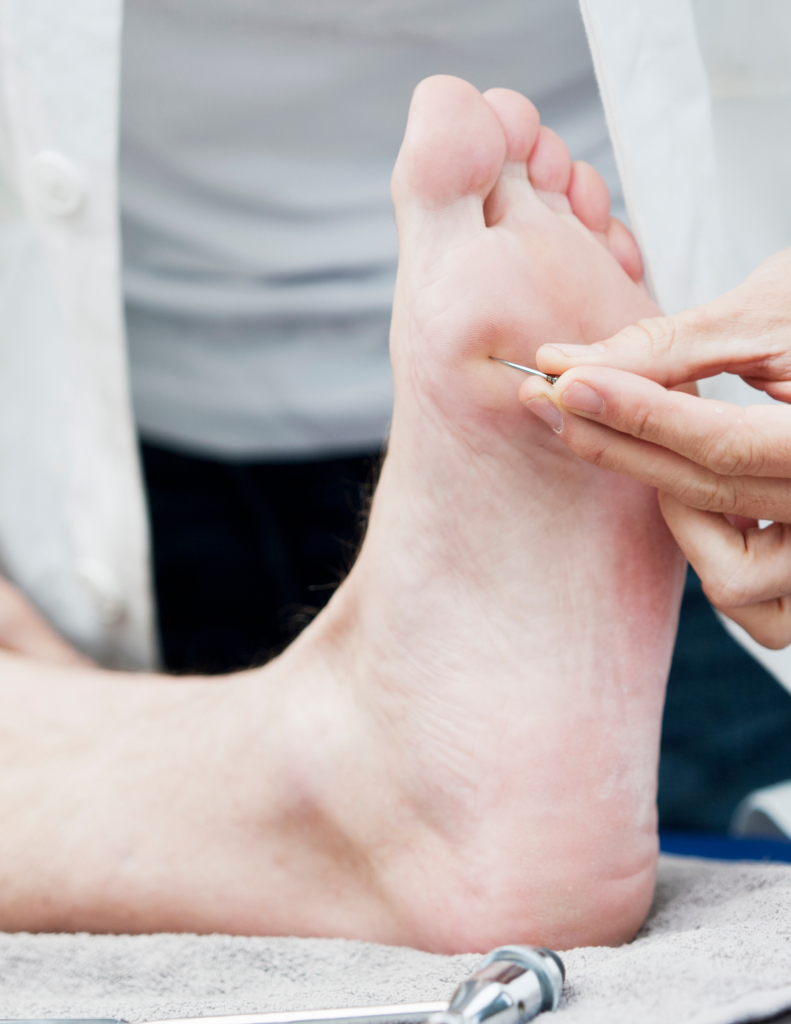 doctor examining foot