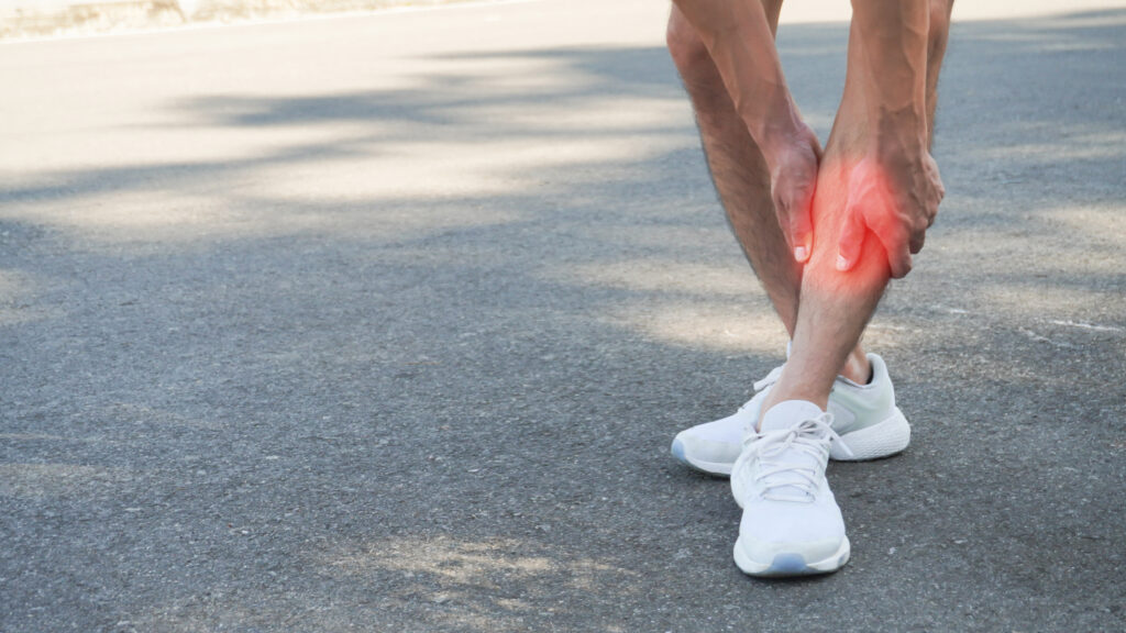 Close-up man shin pain, Running with a sore shin, Shin Splint Syndrome