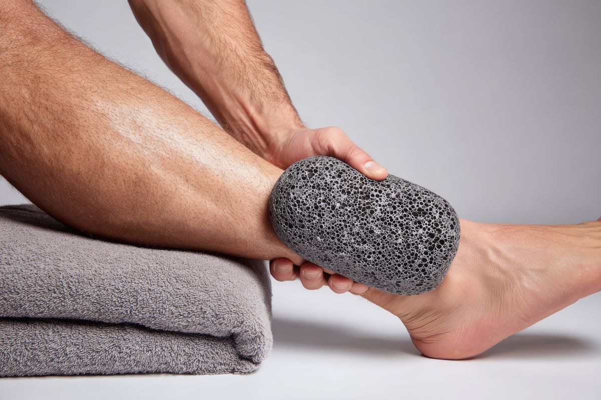 Exfoliating lower extremity with pumice